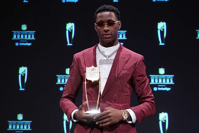 Jets' CB Sauce Gardner holds the 2022 NFL DROTY trophy